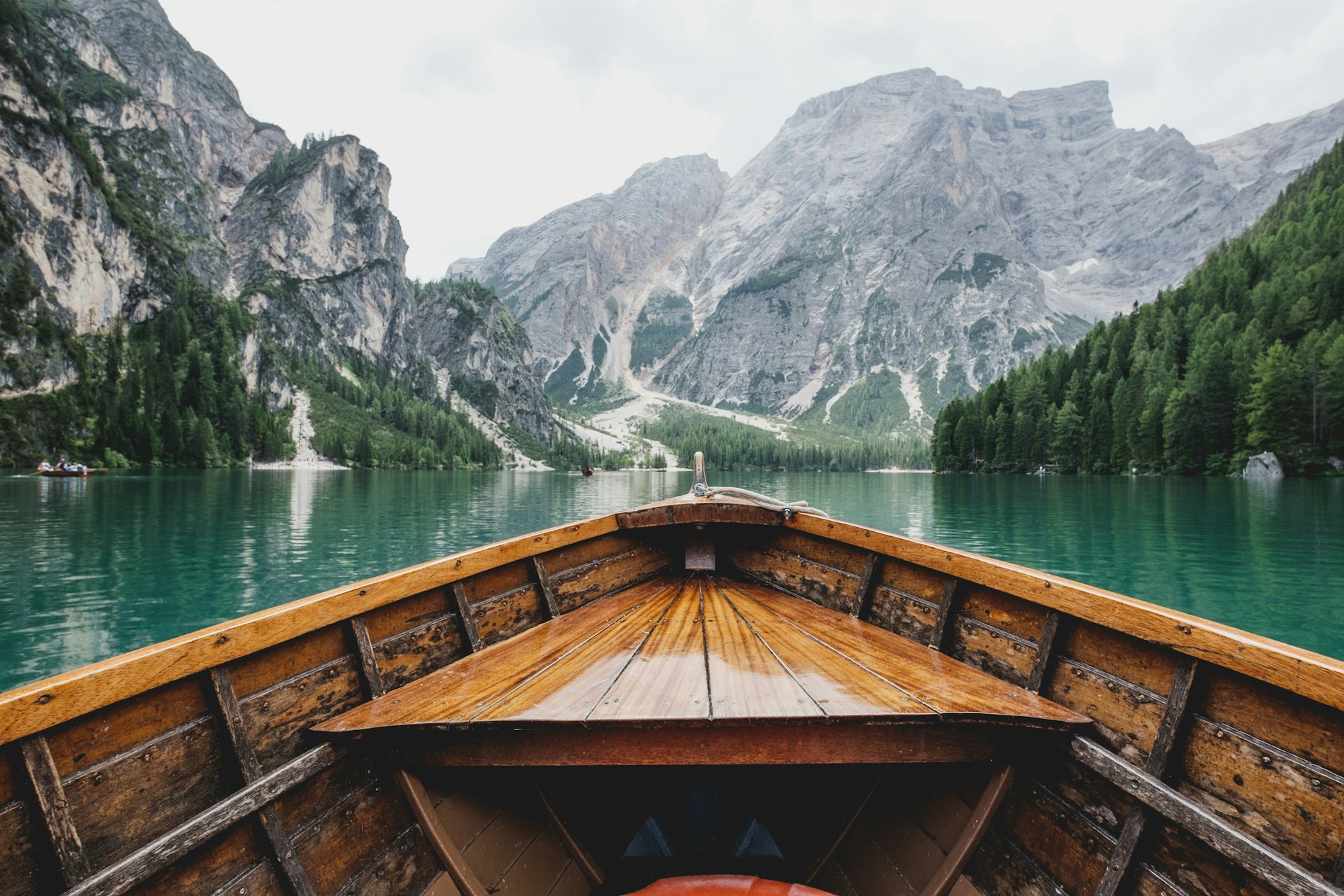 view from a boat on a lake in the mountains